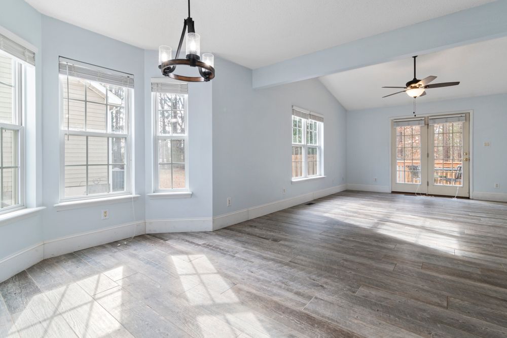 A large open room stripped back and rebuilt with new flooring and fresh walls