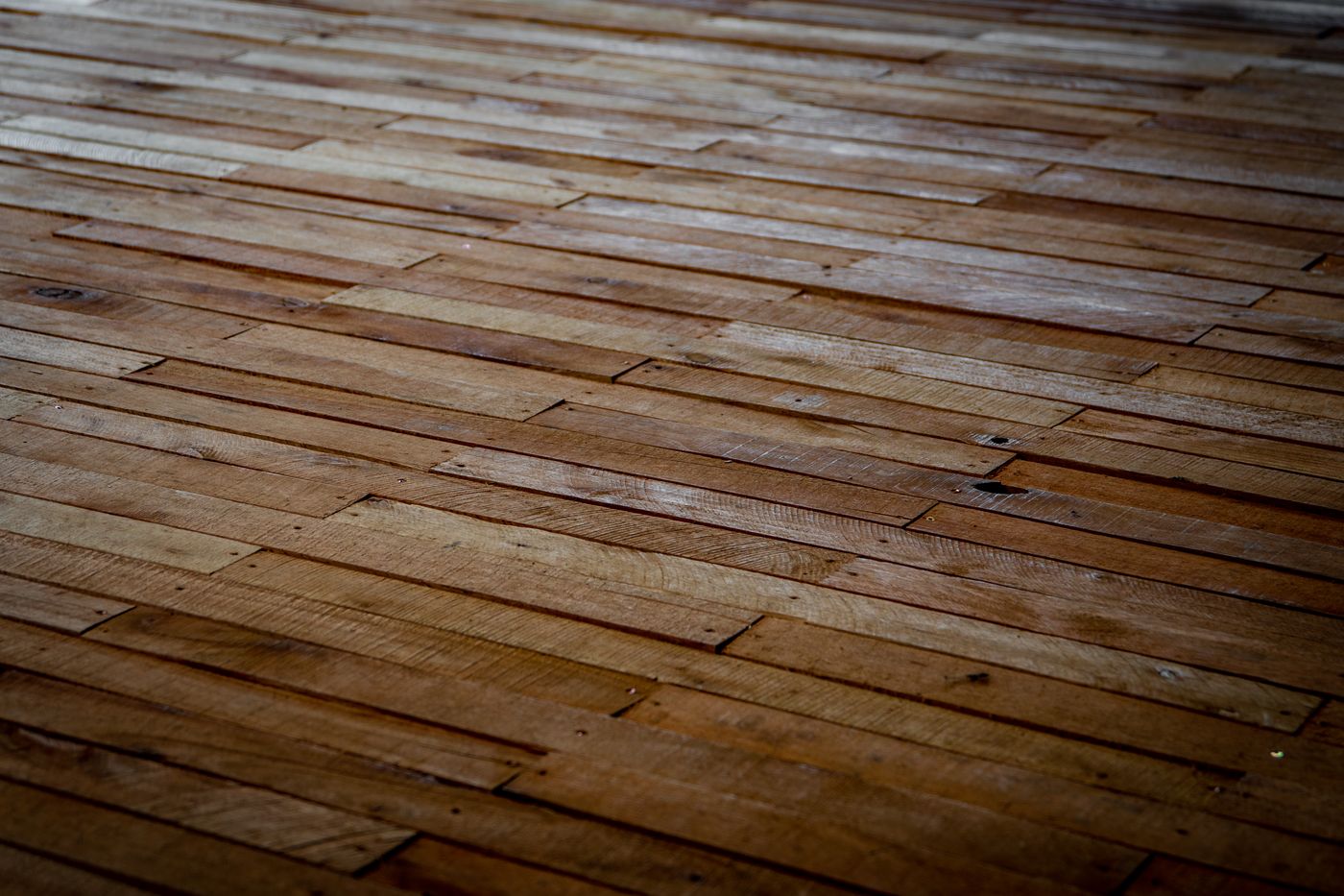 A wide-plank timber floor refinished to a warm natural sheen